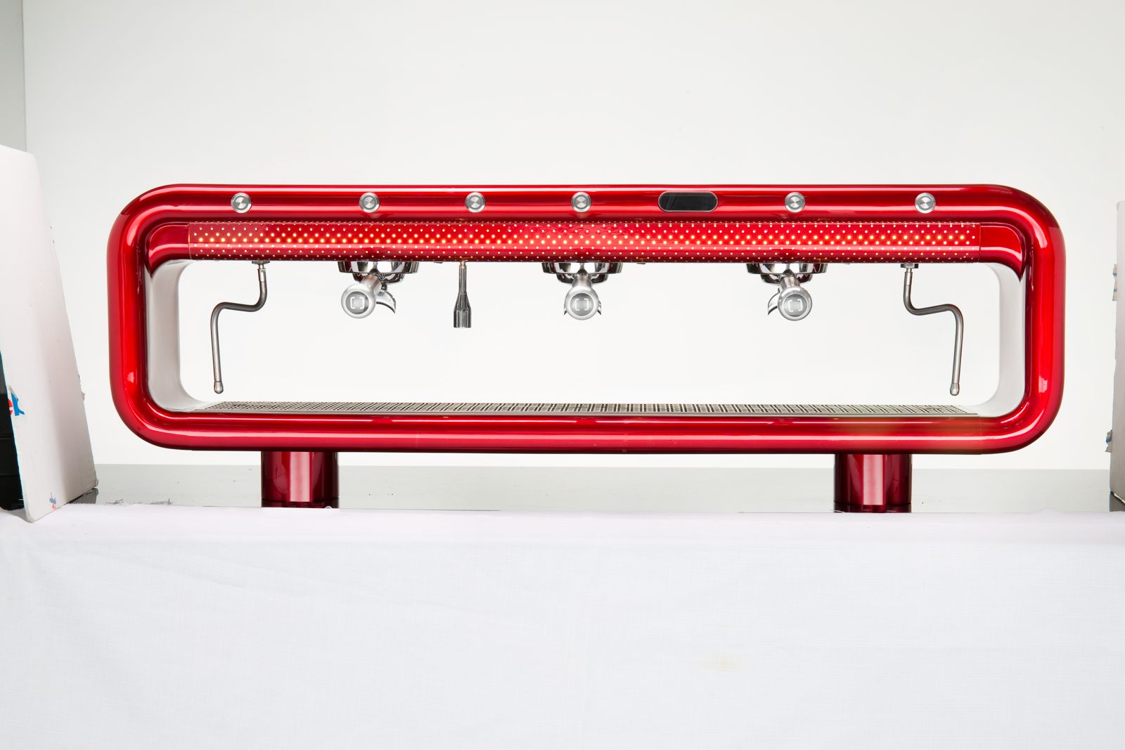 AREMDE espresso machine in ruby red on a white studio background